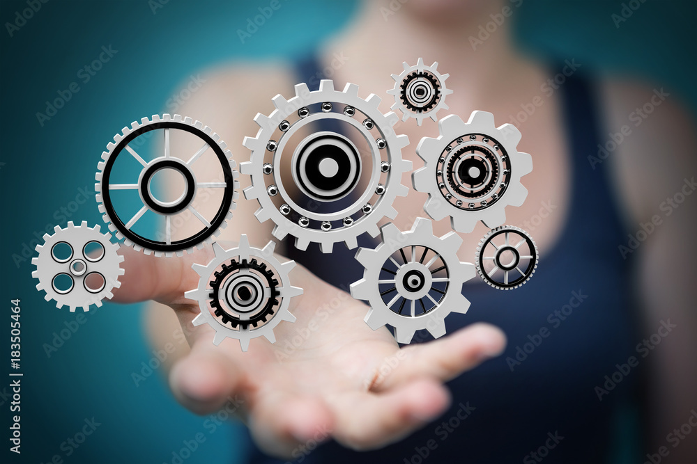 Businesswoman using floating gear icons 3D rendering Businesswoman using floating gear icons 3D rendering