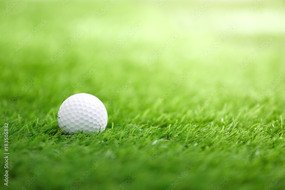 Golf ball on green grass in golf course Golf ball on green grass in golf course