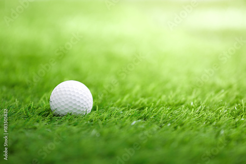 Golf ball on green grass in golf course