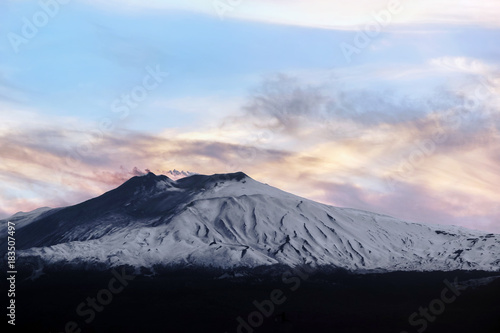 mountain etna in colorful sky at sunset