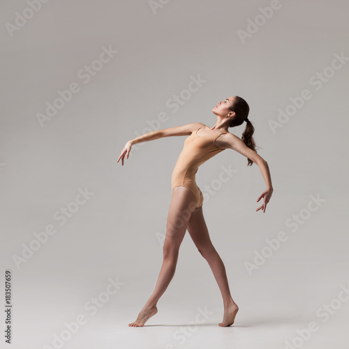 young beautiful dancer in beige swimsuit © Aleksandr Doodko