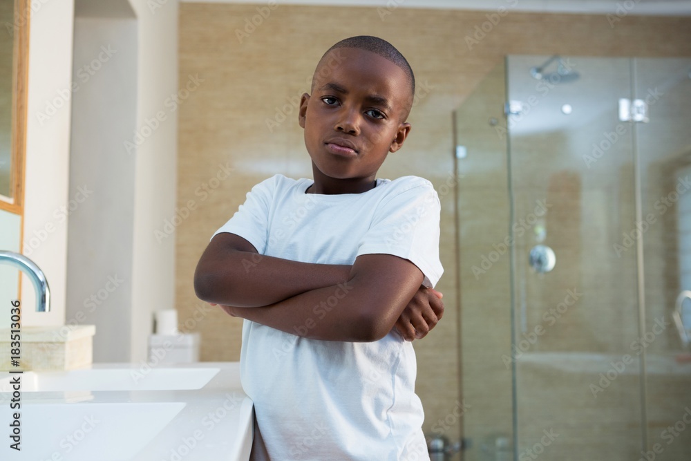 Portrait of boy standing by sink with arms crossed Portrait of boy standing by sink with arms crossed