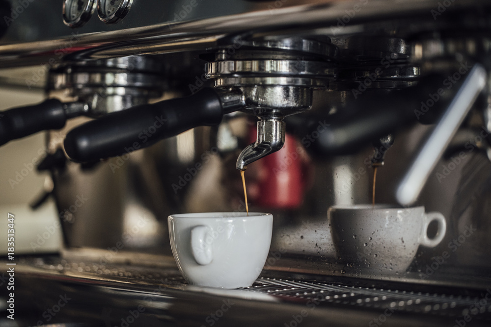 Cup of coffee on coffee maker machine. Cup of coffee on coffee maker machine.