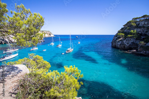 Boats and yachts on Macarella beach, Menorca, Spain