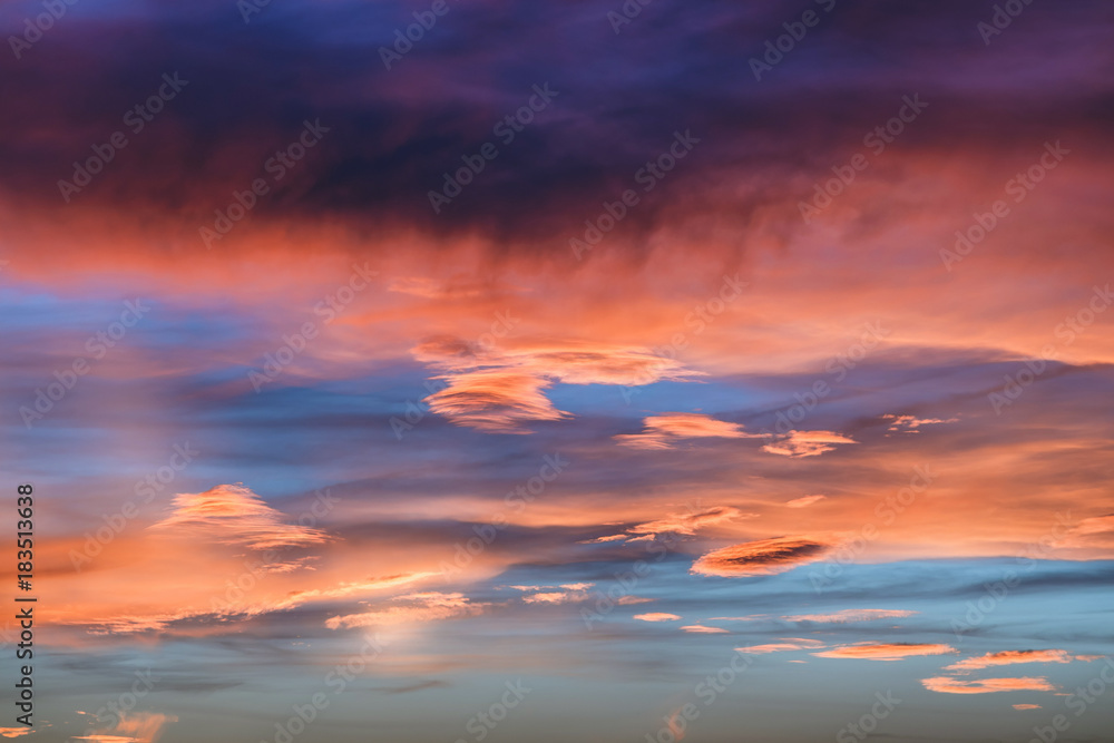 dramatic vibrant colorful clouds during sunset