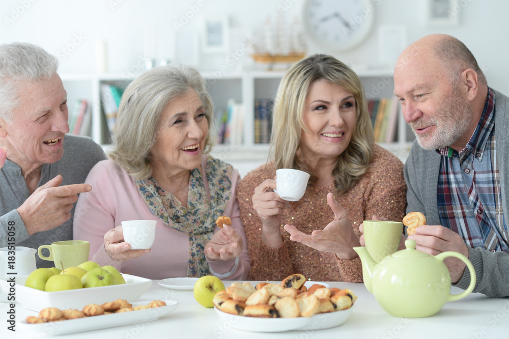 two Senior couples drinking tea two Senior couples drinking tea