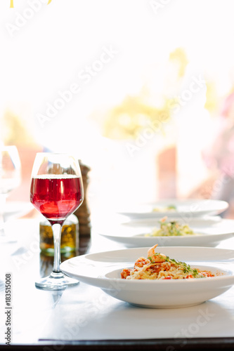 Table in a italian restaurant served with italian pasta.