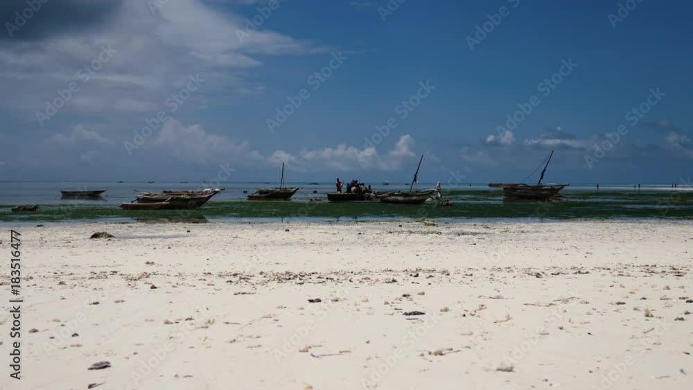 Wooden boats on the beach of Zanzibar Wooden boats on the beach of Zanzibar