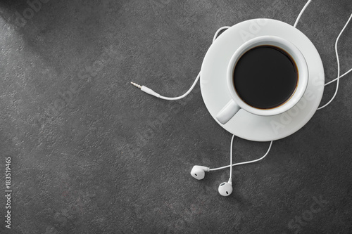 White cup of coffee with headphone