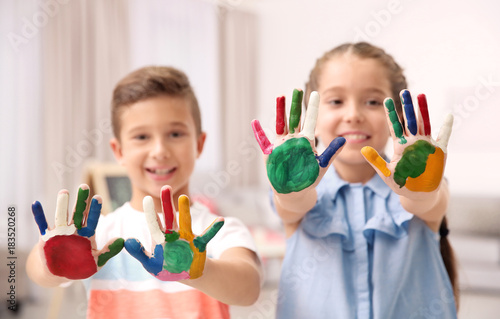 Little children with painte...