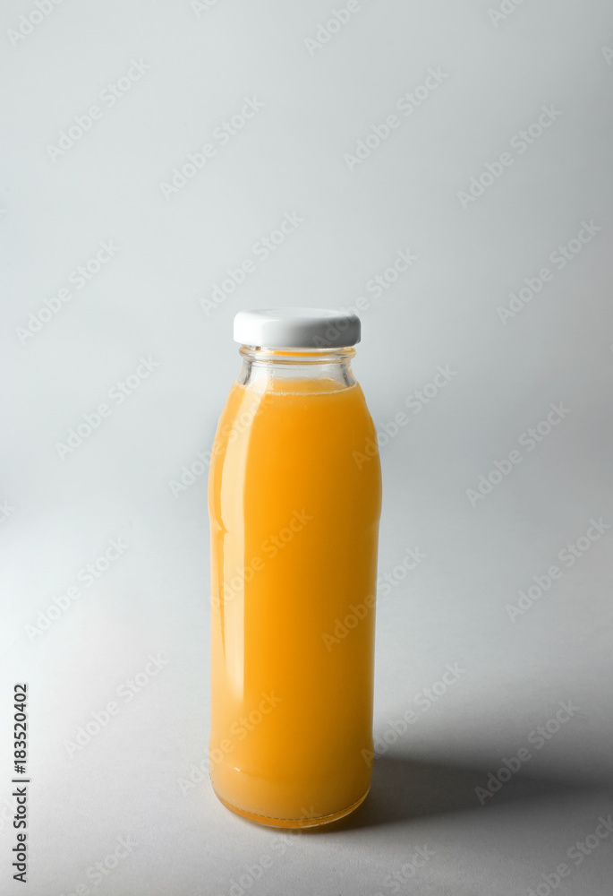Bottle with juice on light background Bottle with juice on light background
