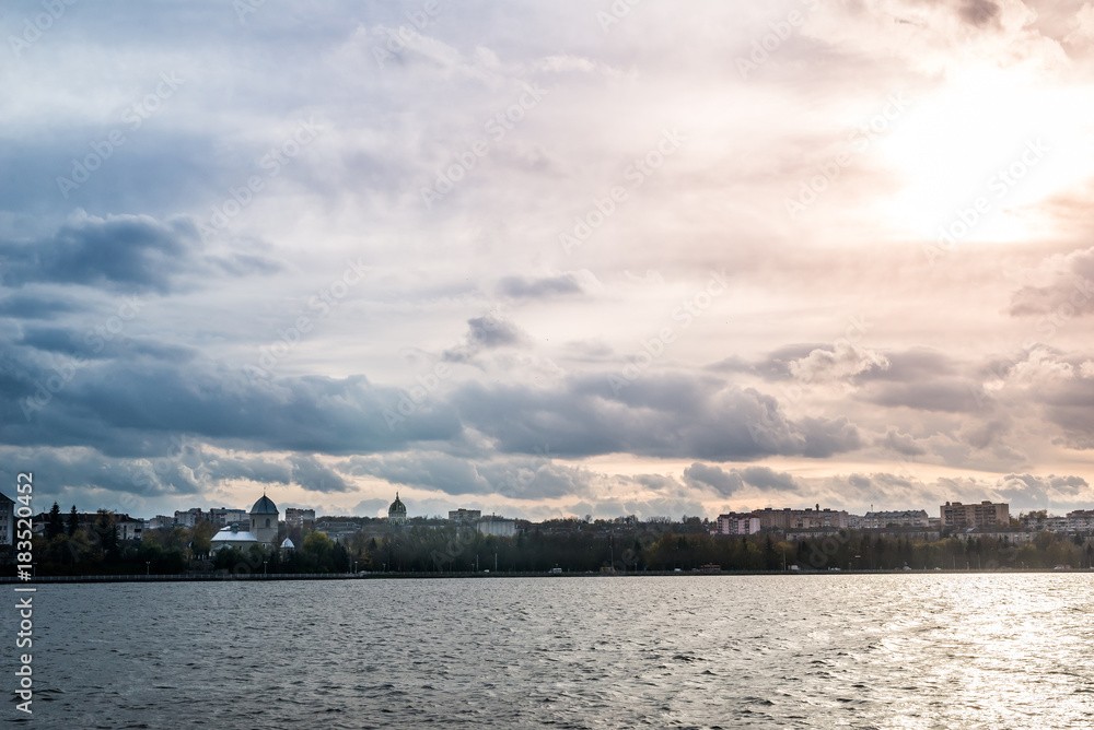 dramatic sunset sky at the lake in city