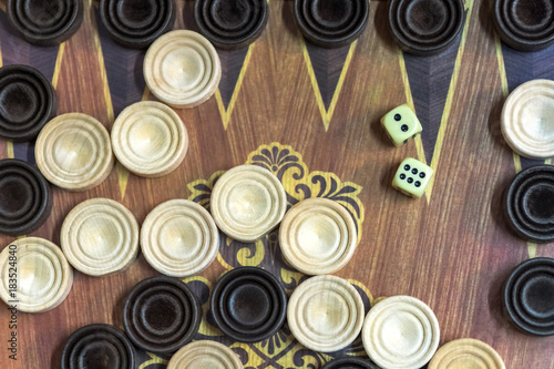 Wooden backgammon. Play a board game.