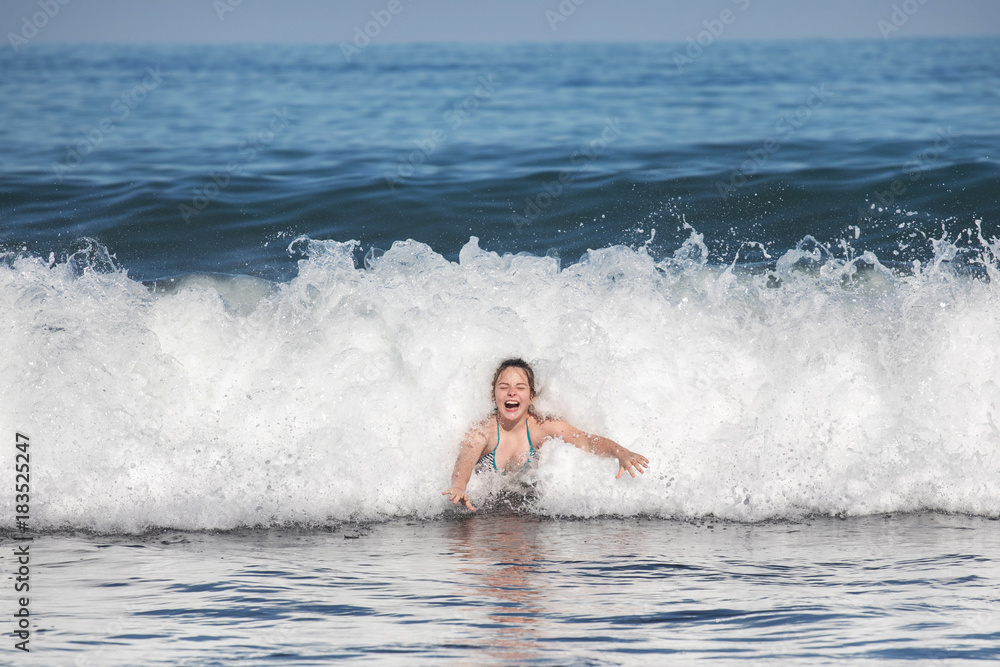 teen girl enjoying the waves
