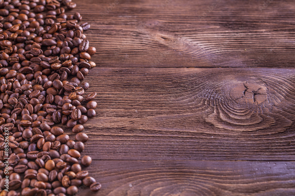 wooden spoon with ground coffee beans background wooden spoon with ground coffee beans background