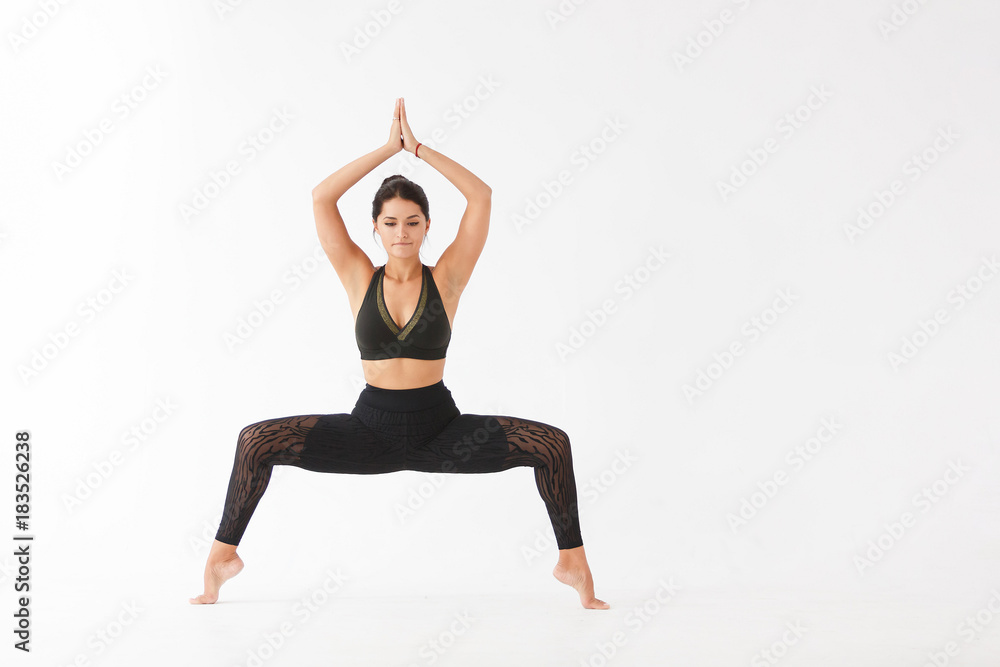 Beautiful young woman doing yoga