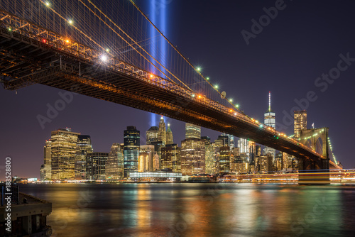 Tribute in Light with the Brooklyn Bridge and the skycrapers of Lower Manhattan. Financial District, New York City