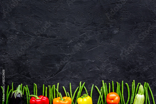Healthy food. Fresh vegetables on black background top view copyspace