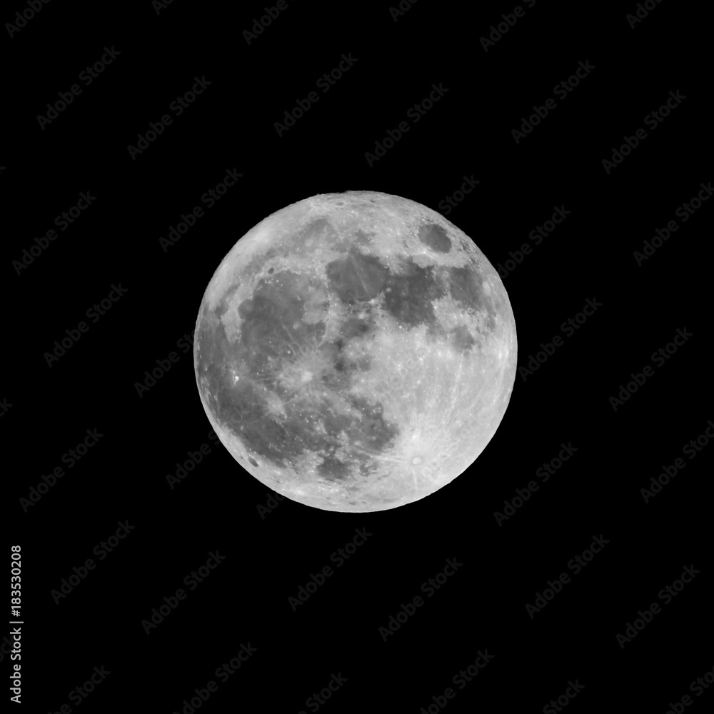 big full moon bright in the black winter sky