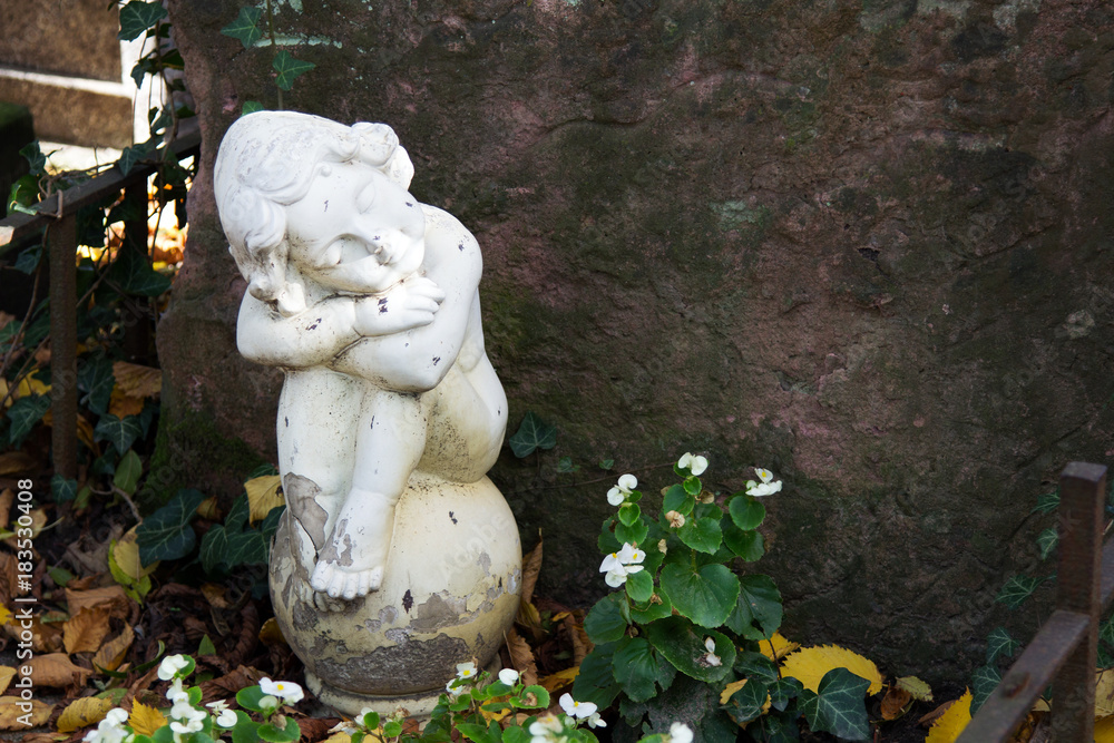 Angel statue at cementery. Relogious symbol, copy space Angel statue at cementery. Relogious symbol, copy space