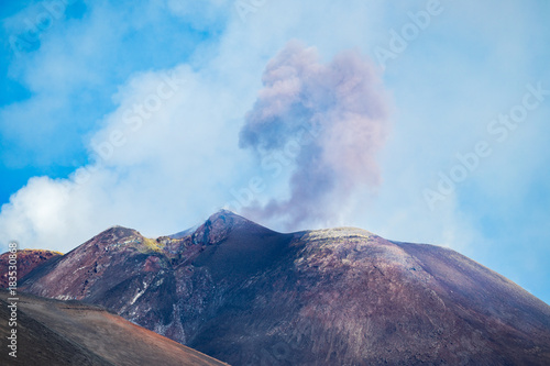 Close up of the new southeast creater of the active volcano Etna, Sicily, Italy, with an ash cloud caused by an explosive event.