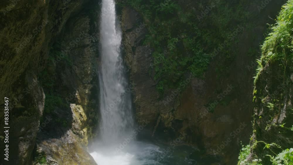 Wide shot of waterfall splashing into pool / Flattach, Austria Wide shot of waterfall splashing into pool / Flattach, Austria