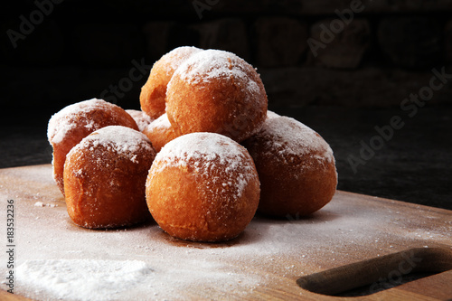 German donuts. berliner or quarkbällchen with jam and icing sugar.