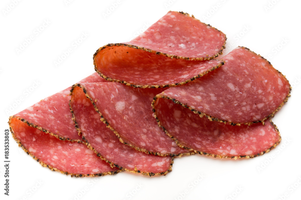 Salami slices isolated on the white background. Salami slices isolated on the white background.