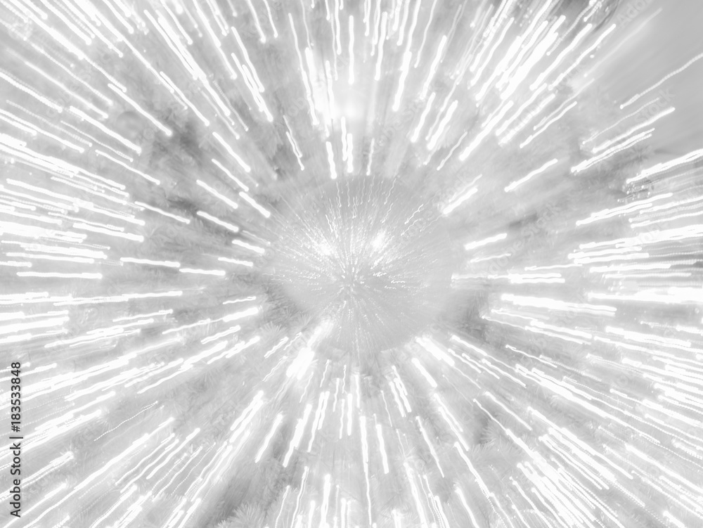 Fototapeta premium zoom burst light blur image of sparkle ball on artificial pine christmas tree, bokeh of LED decorative light defocused background and textured, for Christmas Eve , New Year party holiday celebration
