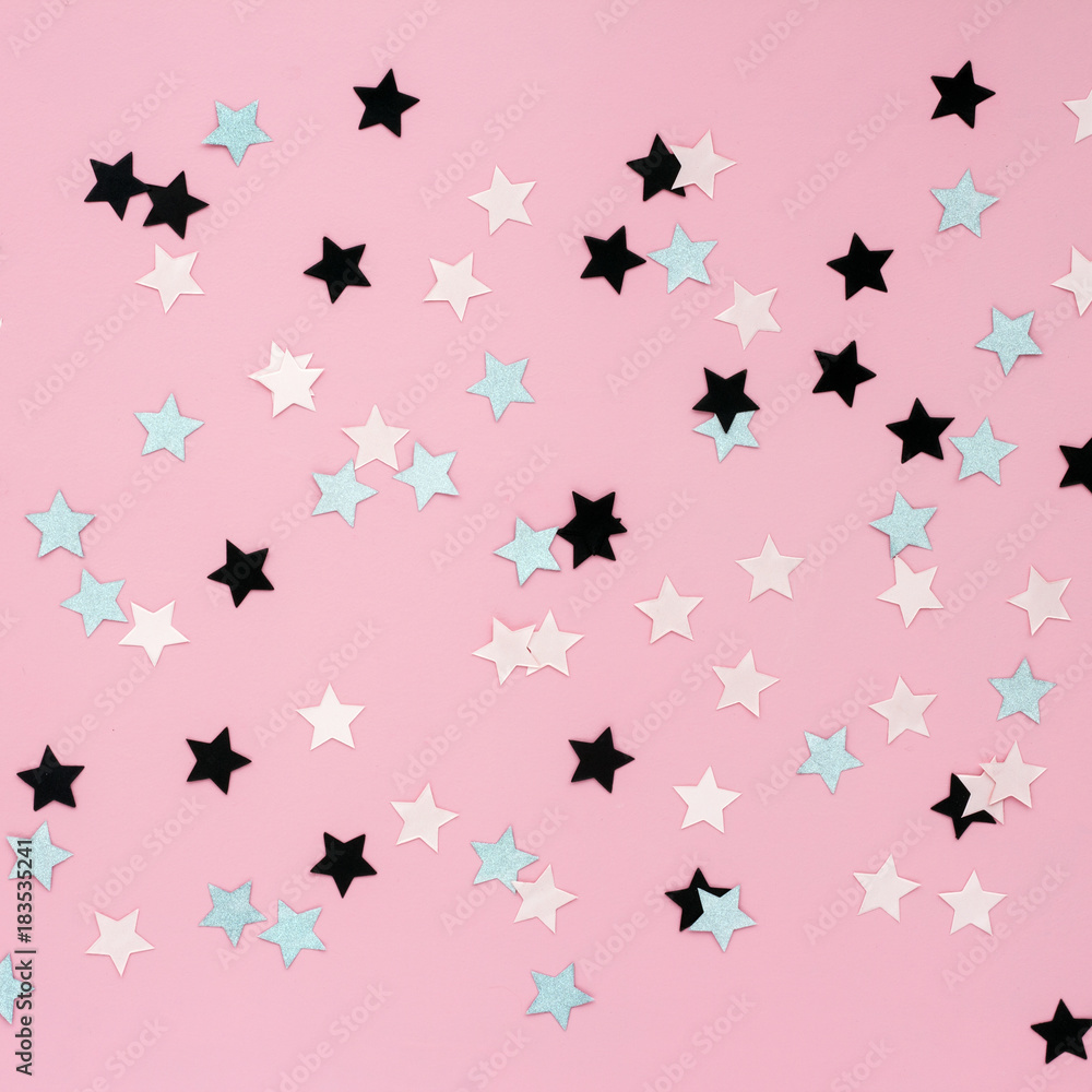 Christmas stars on pink background, flat lay, top view Christmas stars on pink background, flat lay, top view