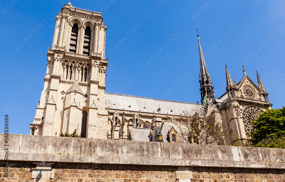 Notre Dame de Paris Catholic Christian Cathedral with the Seine river on a sunny spring day. View from the water. Paris