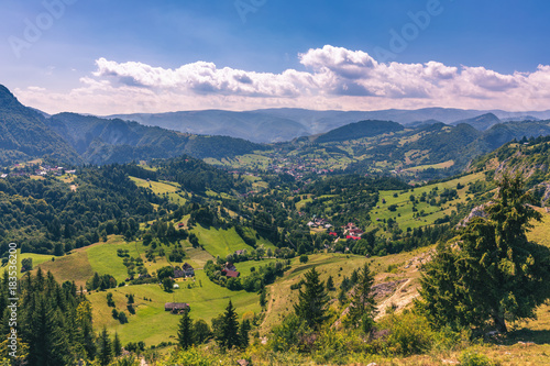 Summer alpine Transylvania landmark, landscape with green fields and valleys, high Piatra Craiului mountains, Carpathians, Transylvania, Romania, Europe