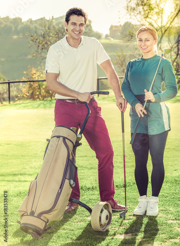 Man and woman golf partners ready to enjoy game