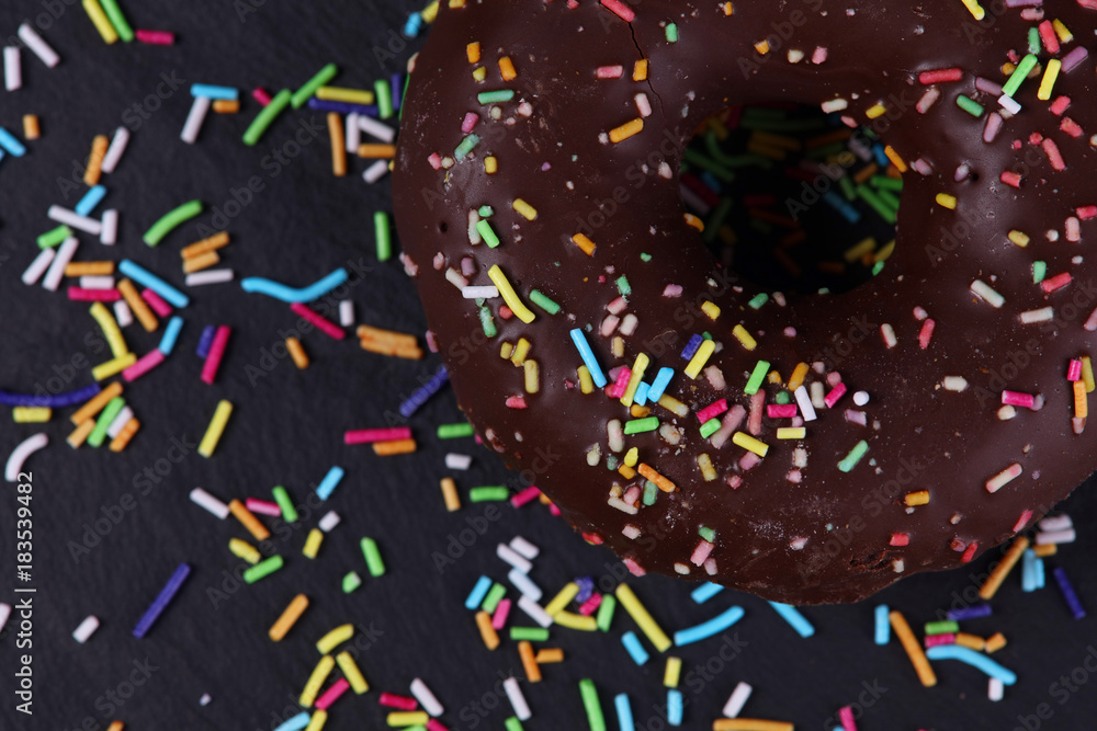 Chocolate Glazed Donuts with Sprinkles close up background