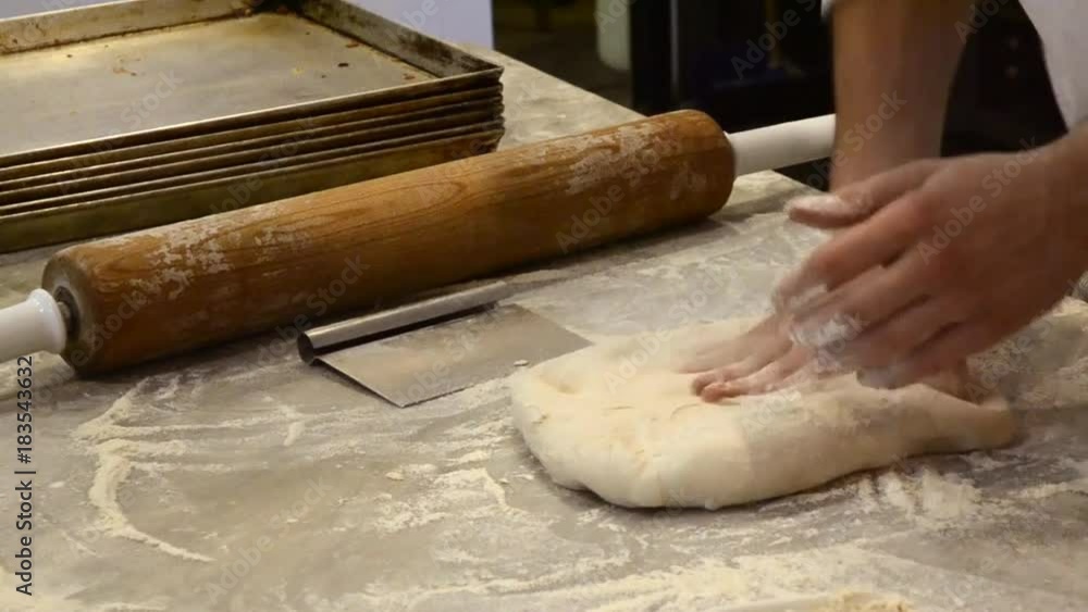 Cook pizza and bread dough preparation. Cook pizza and bread dough preparation.