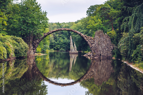 Rakotz bridge (Rakotzbrucke) also known as Devil's Bridge in Kromlau, Germany. Reflection of the bridge in the water create a full circle. © daliu