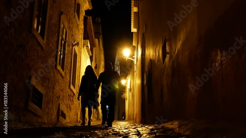 A couple exploring the city at night 