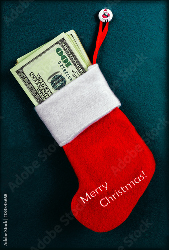 Christmas stocking full of hundred-dollars