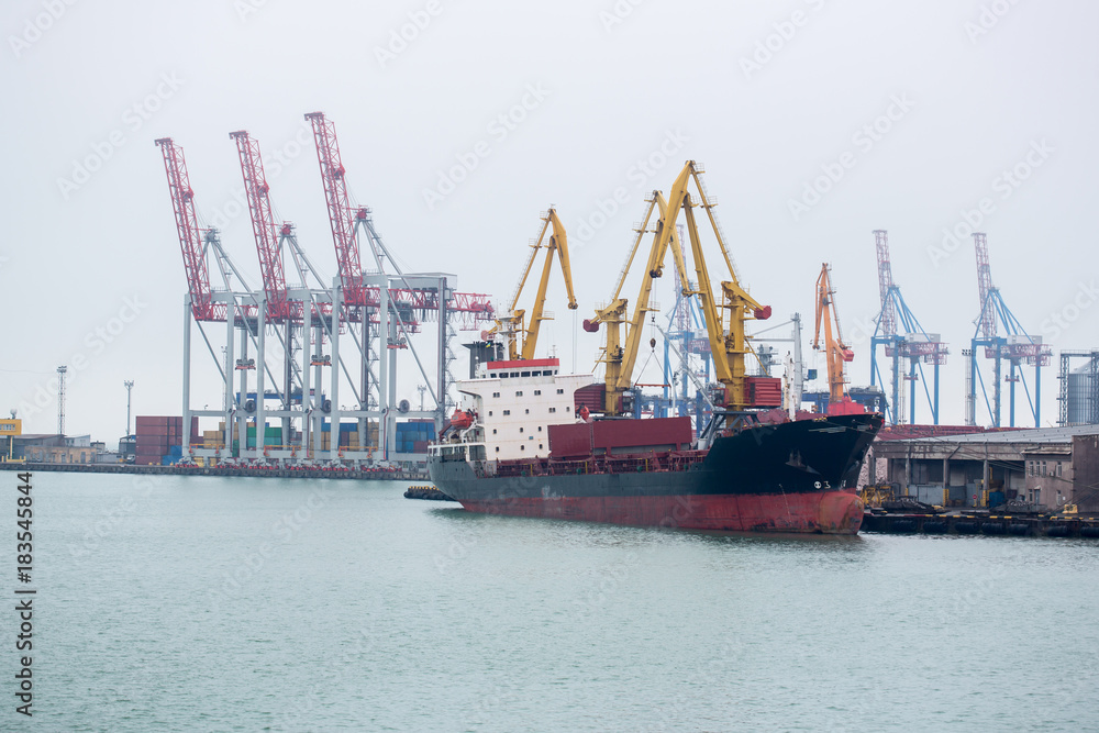 Vessel dry cargo on loading, unloading in port. Bulker in port. port terminal