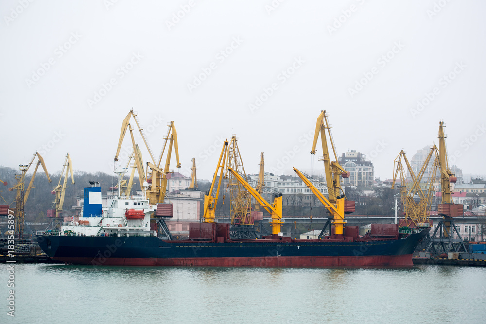 Vessel dry cargo on loading, unloading in port. Bulker in port. port terminal