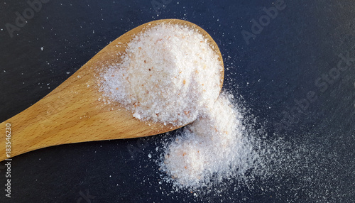 Wooden spoon of pink himalayan salt