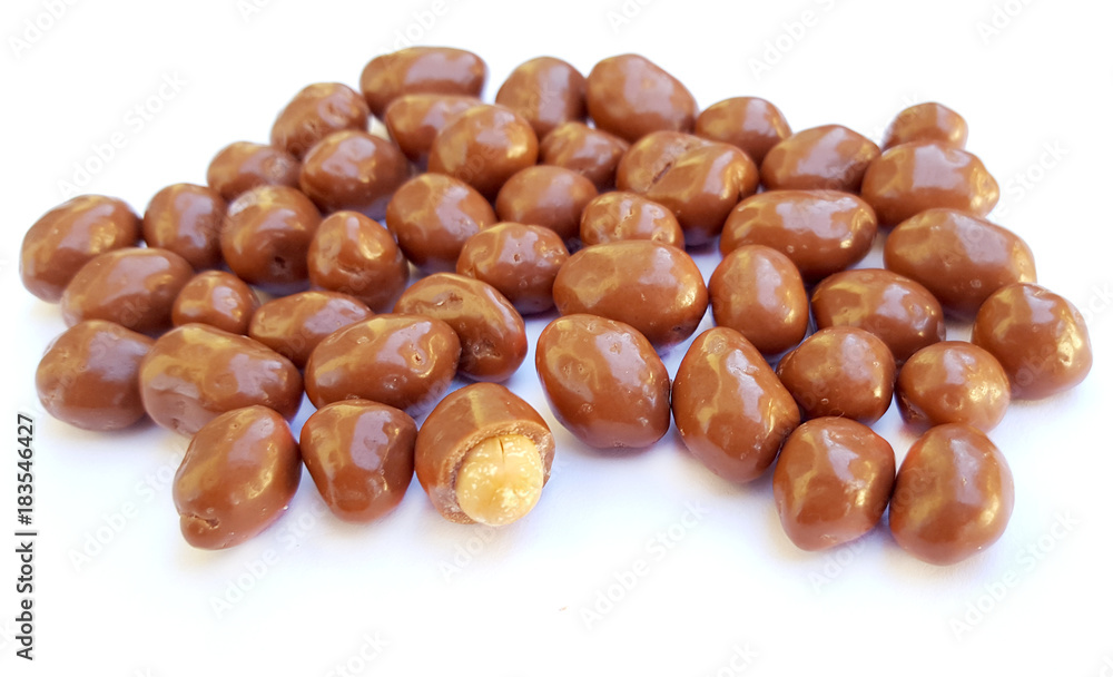 Peanuts in chocolate on a white background Peanuts in chocolate on a white background