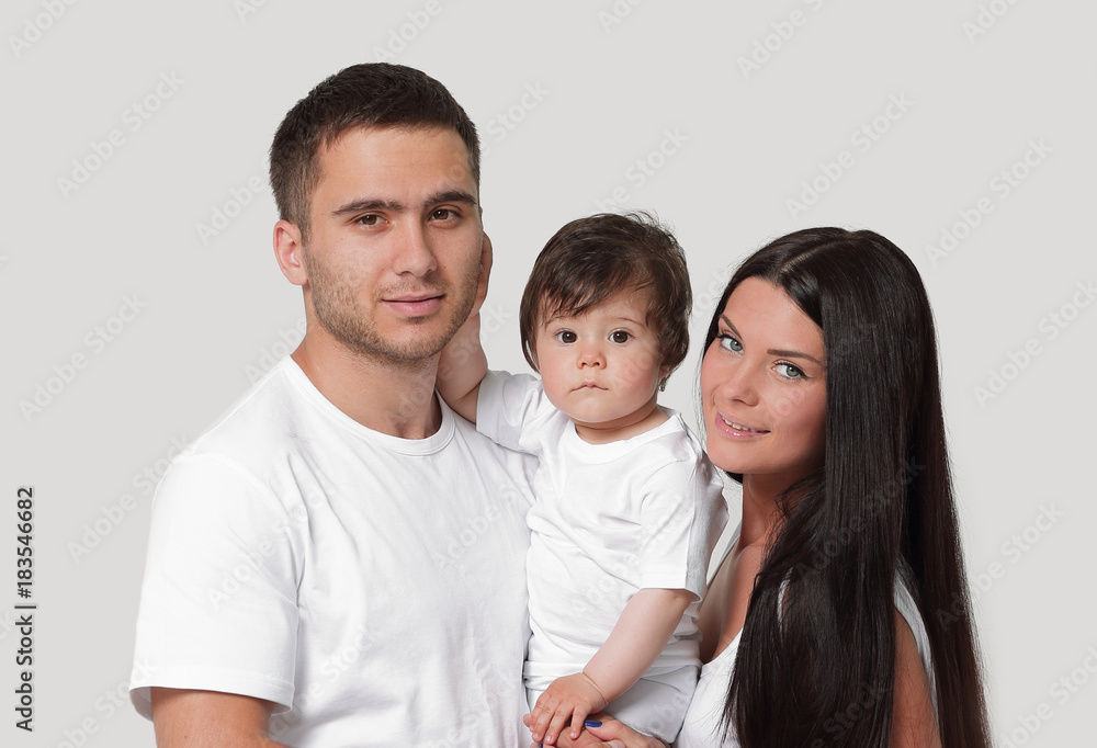 Happy family with newborn baby on a white background. Happy family with newborn baby on a white background.