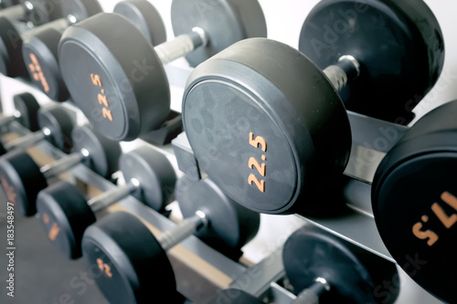 Sports dumbbells in modern sports club. Weight Training Equipment