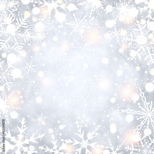 Shining winter background with snowflakes.