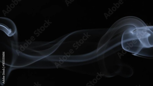 White tobacco smoke line cloud on black background 4k slow-motion video with copy space. Smoking wave floating steaming: cigarette, cigar, vaping, pipe. Nicotine addiction