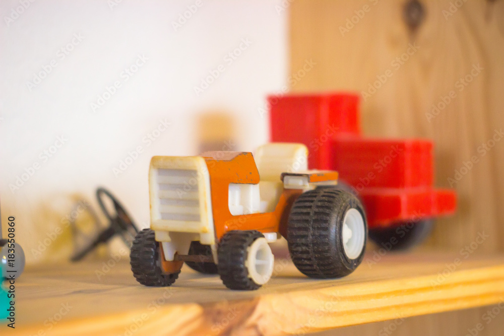 Fototapeta premium rare vintage red tractor toy on white