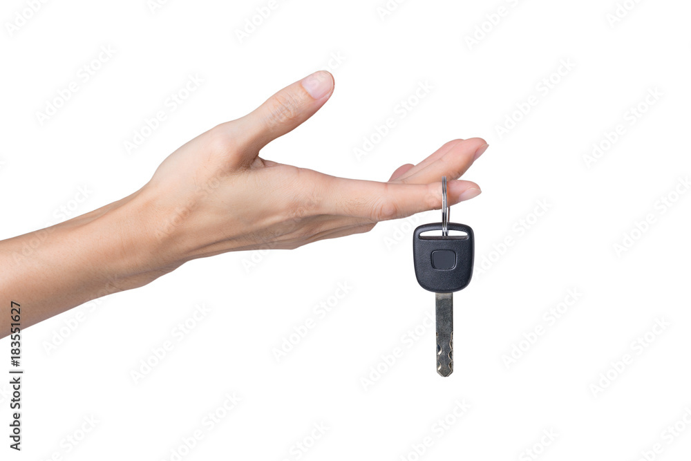 Hand holding car key isolated on white background Hand holding car key isolated on white background