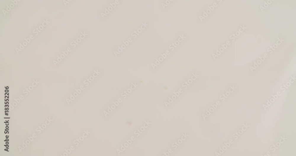 Milk drop drips to liquid white surface 4k slow-motion close-up video nature background with copy space. Milk falling and splashing. Abstract circles. Dairy breakfast Milk drop drips to liquid white surface 4k slow-motion close-up video nature background with copy space. Milk falling and splashing. Abstract circles. Dairy breakfast