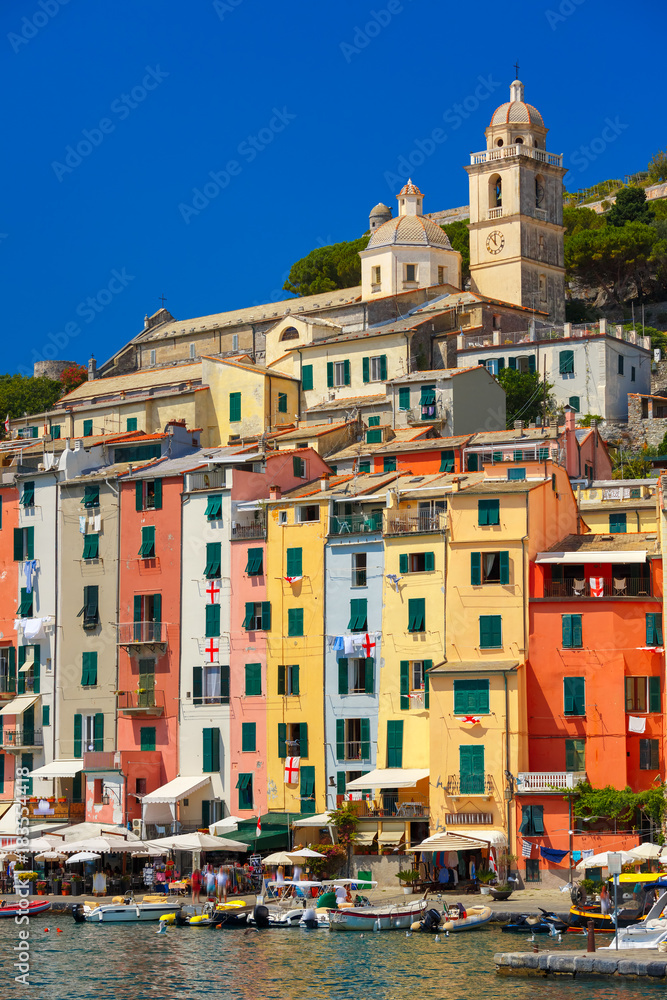 Colorful picturesque harbour of Porto Venere, San Lorenzo church on the background, La Spezia, Liguria, Italy.